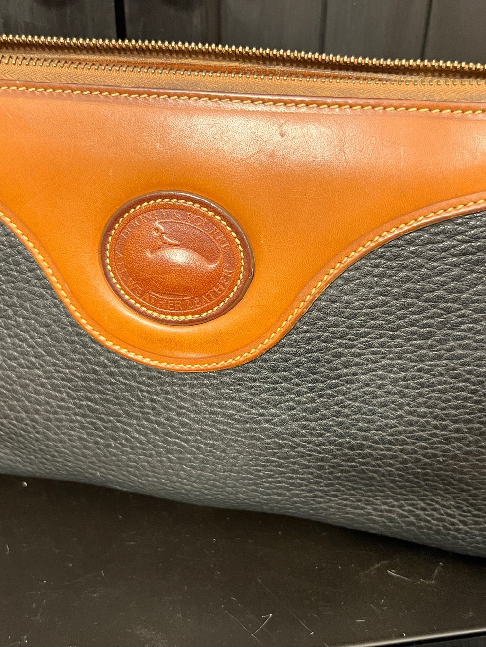 Dooney & Bourke Black Pebbled Leather Pouch with Brown Trim